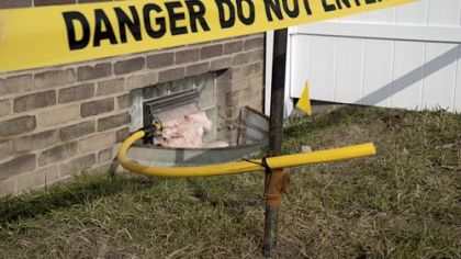 Gas company employees must test this temporary vent to see if it's safe for Nick Kellington and his family to visit their home. The Kellingtons were evacuated after gas from a nearby abandoned well caused a small explosion in West Mifflin.
