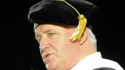 Gov. Tom Corbett speaks at commencement ceremonies for the Duquesne University School of Law at the school's A.J. Palumbo Center on Sunday.