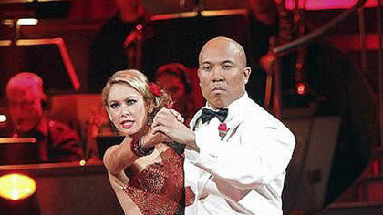 Kym Johnson and Hines Ward on the stage.