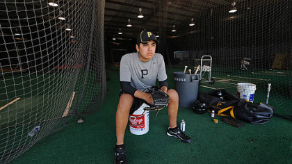 Pirates pitching prospect Luis Heredia watches drills at Pirate City in Bradenton, Fla.
