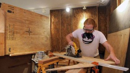 William Kofmehl III assembles his installation art, "Vicarious Suffering: A 21st Century Site."