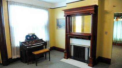 The living room has large windows and a fireplace -- one of five in the home.