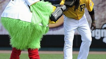 Outfielder Andrew McCutchen gets a camera-eye view from the Pirate Parrot before the start of the Pirates' game against the Toronto Blue Jays at McKechnie Field Sunday in Bradenton, Fla.