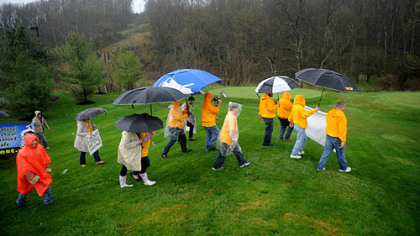 A group of protesters gather and march from the UFCW Local 23 office to the Southpointe headquarters for Range Resources to call for a gas extraction tax.