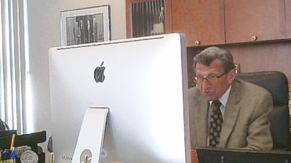 A photo taken from Penn State quarterbacks coach Jay Paterno's Twitter account shows Joe Paterno working at his computer. The veteran coach uses web tools such as Skype to communicate with potential football recruits.