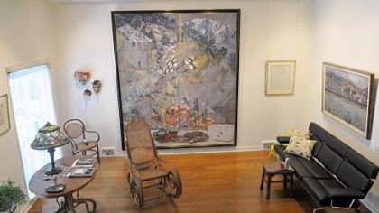 Solid hardwood floors run throughout the house, including the living room designed to show Mr. Koerner's work.