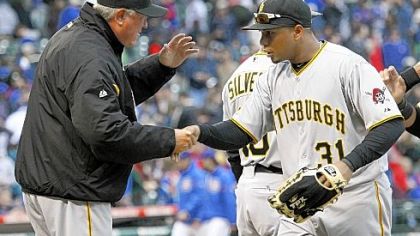 Manager Clint Hurdle and Jose Tabata celebrate the Pirates' 5-4 victory Sunday against the Chicago Cubs at Wrigley Field.