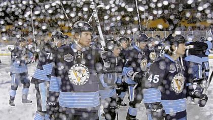 Jordan Staal and the Penguins raise their sticks in tribute to the fans at Heinz Field after Saturday's Winter Classic.