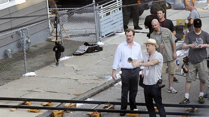 Christopher Nolan, left, sets up a scene with cinematographer Wally Pfister on 41st Street in Lawrenceville on Friday.
