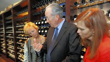 The Carlton is now offering its wine list on iPads to keep the list as up to date as possible. Proprietor Kevin Joyce demonstrates how the iPad app works to customers Laura Ellsworth, left, and Laura Meaden.