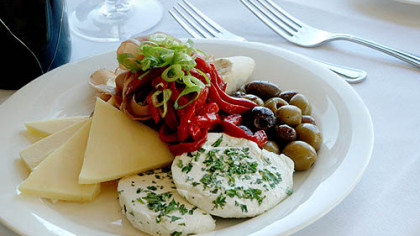 Cheese, pepper and olive appetizer plate.