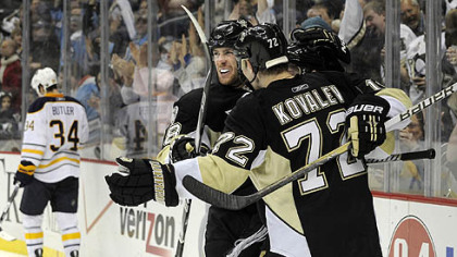 Penguins forwards James Neal and Alex Kovalev congratulate teammate Mark Letestu after scoring in the third period against the Sabres Tuesday at Consol Energy Center.