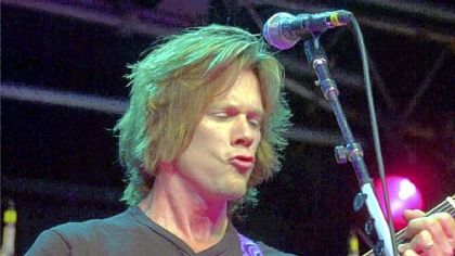 Actor and musician Kevin Bacon, shown playing at the Philadelphia Folk Festival in 2000, along with his brother,  Michael, helped save the Mummers Parade in Philadelphia.