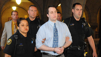 Richard Poplawski is escorted from the Allegheny County Courthouse.