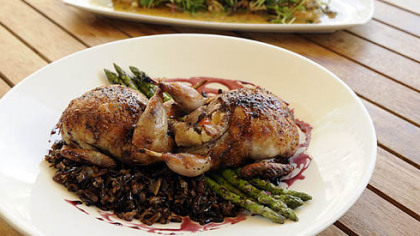 The real thing, done well: Wood roasted quail (foreground) with frog legs