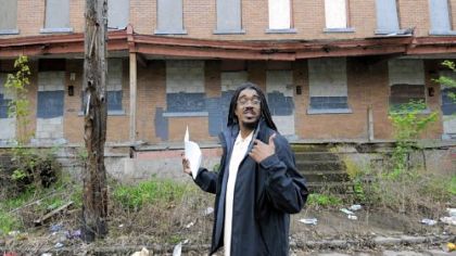 Jerome Jackson of Homewood's Operation Better Block at blighted row houses in the 7300 block of Sterrett Way.