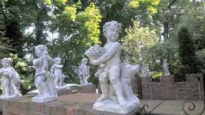Individually hand-cast angels statuary sit on the wall of the courtyard. "We would put a couple [angels] up every time Henry got paid for a cover for Time magazine," Joan Koerner said.