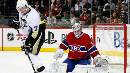 Canadiens goaltender Carey Price gets down to stop the puck deflected by Penguins forward Evgeni Malkin during Wednesday's game at the Bell Centre in Montreal.