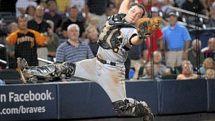 Pirates catcher Michael McKenry catches a pop fly off the bat of Braves Nate McLouth with bases loaded against the Braves during the sixth inning Monday night.
