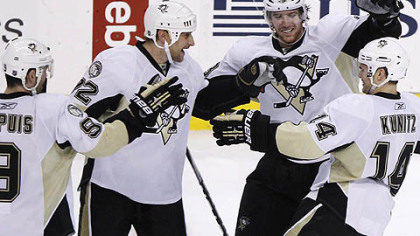 Penguins forwards Chris Kunitz, James Neal, Alexei Kovalev and Pascal Dupuis celebrate Kunitz's  shootout goal following Thursday's game against the Flyers at the Wells Fargo Center in Philadelphia.