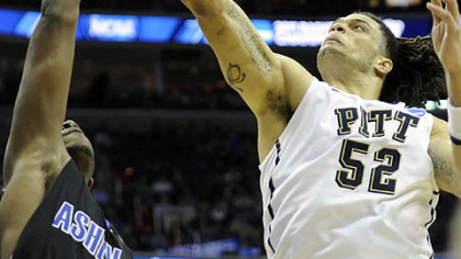 Pitt's Gary McGhee reaches for a rebound against UnC Asheville's Quinard Jackson in the second half of Thursday's NCAA tournament game in Washington.