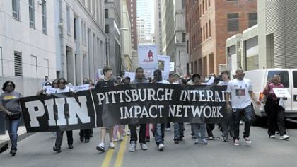 Organized by CeaseFirePA and the Pittsburgh Interfaith Impact Network, a protest march against gun violence, which began at Freedom Corner in the Hill District, moves through Downtown en route to the David L. Lawrence Convention Center, Downtown, on Saturday.