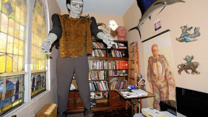 A small room off the former alter is an eclectic mix of his art, including Frankenstein, Jack Lambert's head and a painting of Riccobon in a gorilla suit.