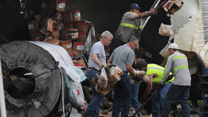 The cleanup continued after dawn at the site of the Interstate 70 crash.
