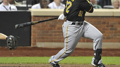 The Pirates' Josh Harrison an RBI single off of Mets pitcher R.A. Dickey to tie the game, 1-1, in the eighth inning Tuesday at Citi Field in New York.
