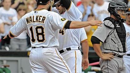 Neil Walker greets Ryan Doumit at home plate after Doumit hit an eighth-inning, three-run home run to lift the Pirates to a 5-4 victory against the Houston Astros. The Pirates' record stands at 17-17.