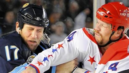 Penguins' Michael Rupp: "There's no secret that we don't like each other." Shown here, the Capitals' John Erskine lands a right cross on Rupp in their clash in the first period at Heinz Field last night.