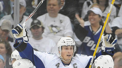 Lightning captain Vincent Lecavalier celebrates his first period goal with teammates Martin St. Louis and Steven Stamkos during Friday's game at Consol Energy Center.