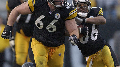 Steelers guard Alan Faneca leads a block for wide receiver Hines Ward against the Falcons Nov. 10, 2002 at Heinz Field. Faneca announced his retirement yesterday.