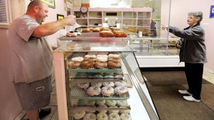 It's coconut, always coconut, when daily customer Lillie Davis comes calling at the Better-Maid Donut Co. on Steuben Street in Elliott. Ken Smith's shop has been a haven for doughnut lovers since he and brother Al Smith bought the business in 2004.