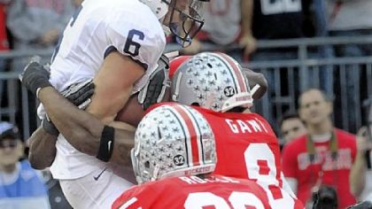 Derek Moye goes up over two Ohio State defenders to score against the Buckeyes last season.
