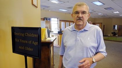 McDains owner Mike Vuick stands at the restaurant on Saturday.