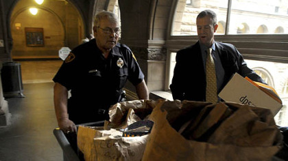 Pittsburgh police Officer Terry Traxler, left, and Deputy District Attorney Mark V. Tranquilli take Poplawski trial evidence into the Allegheny County Courthouse before the start of Thursday morning's session.