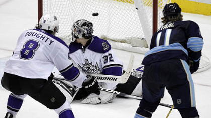 Penguins forward Jordan Staal fires a shot past Kings goaltender Jonathan Quick as Kings defenseman Drew Doughty gives chase in overtime of Thursday's game at Consol Energy Center.