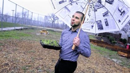 Matt Bartko holds some of the seedlings he and other neighbors in South Oakland will plant in May in this garden area he created near the ballfield on Frazier Street.