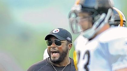 Steelers head coach Mike Tomlin provides some motivation for his players during training camp at Saint Vincent College in Latrobe.