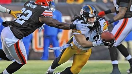 Troy Polamalu intercepts a pass from Browns quarterback Colt McCoy in the first quarter.