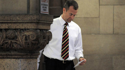 Lead prosecutor Mark Tranquilli reviews notes before the start of today's session in Richard Poplawski's murder trial.