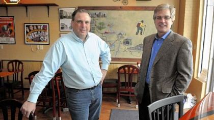 Progress Fund CEO David Kahley (right) with Rod Darby, owner of The Trailside, a restaurant and bar along the Great Allegheny Passage Trail in West Newton.