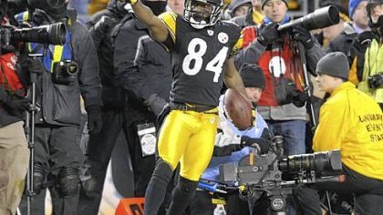 Receiver Antonio Brown celebrates after catching a pass from  Ben Roethlisberger in the fourth quarter to seal the victory against the Jets in the AFC championship Sunday at Heinz Field.