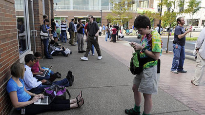 Bridget Spitznagel, a Google software engineer, kept busy knitting socks as she and others from Google and other companies waited outside Bakery Square offices in East Liberty after the earthquake.