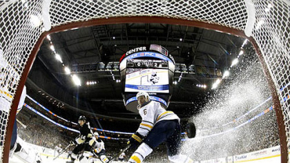 Sabre defenseman Mike Weber watches a shot by Penguins forward Tyler Kennedy go in the net during Friday's game at at Consol Energy Center.