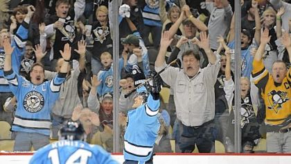 The Departed: Alex Goligoski celebrates a game-winning goal for the Penguins against the Islanders in December. Goligoski was dealt to the Dallas Stars this afternoon.