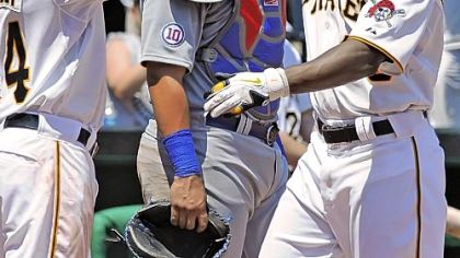 Alex Presley, left, greets Andrew McCutchen at home plate after McCutchen hit a three-run home run in the third inning against the Chicago Cubs Sunday at PNC Park.