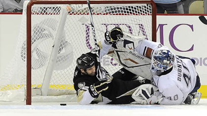 The Penguins' Maxime Talbot scores a goal on Edmonton's Devan Dubnyk.