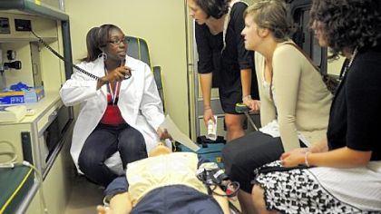 Clarice Burse, left, 17, of Peabody High School discusses the STAR Center at the West Penn School of Nursing with Mary Sasson, second from left, Alison Winters and Lauren Schieb last June after she graduated from the STAR Allied Health Leadership Training Academy. The academy is designed to prepare students for future health care studies and jobs.